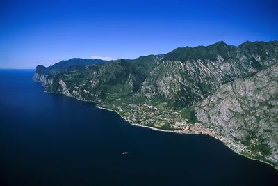 Scenic view of lake garda against clear blue sky