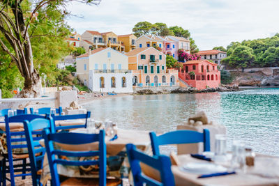 Colorful houses by beach during sunny day