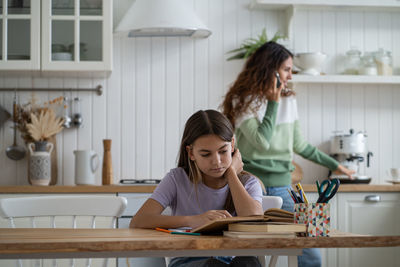 Female friends working at home