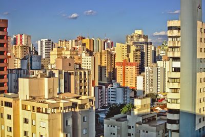 High angle view of buildings in city against sky