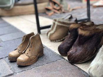 Close-up of shoes on the ground