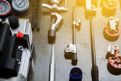 High angle view of work tools on table at workshop