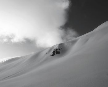 Scenic view of snowcapped mountain against sky