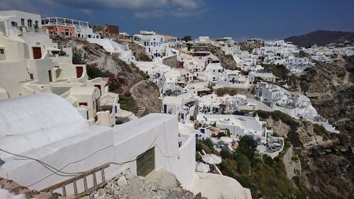 High angle view of residential district against sky