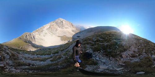 Panoramic view of mountains against clear blue sky