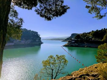 Scenic view of sea against clear blue sky