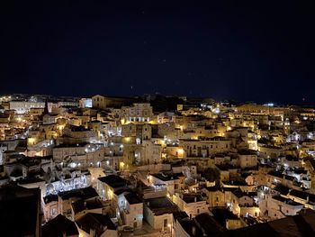 High angle view of illuminated buildings in city at night