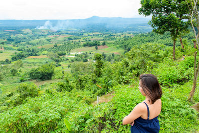 High angle view of woman standing against landscape