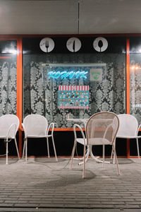 Empty chairs and tables in cafe