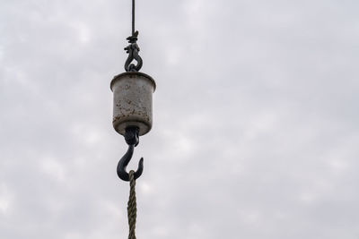 Low angle view of street light against sky