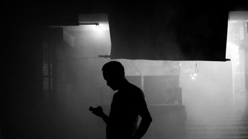 Woman in dark room