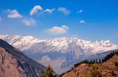 Scenic view of snowcapped mountains against sky