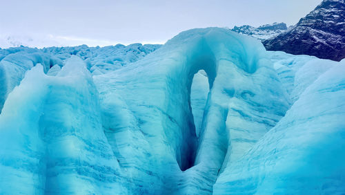 Iceberg floating in greenland fjord.