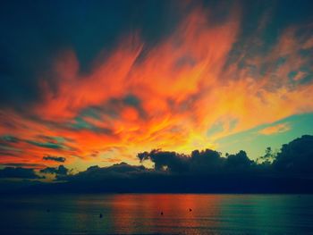 Scenic view of sea against romantic sky at sunset