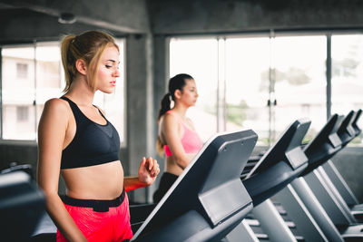 Women running on treadmill in gym