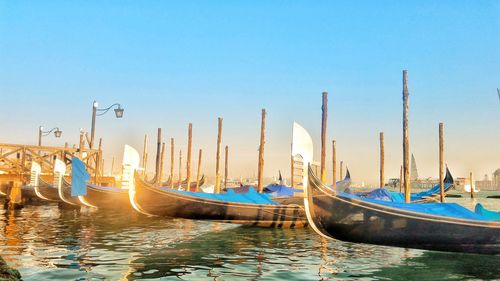 Boats moored at dock