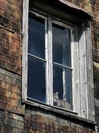 Low angle view of window of old building