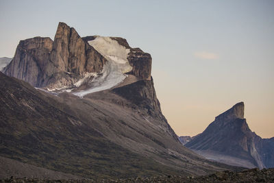 Rock formations on mountain against sky