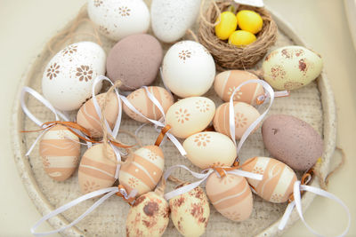 High angle view of easter eggs in plate on table