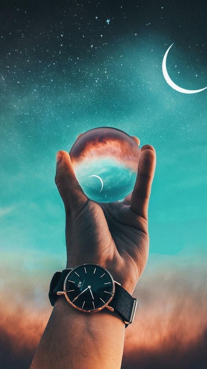 human hand, hand, one person, human body part, real people, sky, star - space, body part, human finger, finger, holding, personal perspective, space, lifestyles, unrecognizable person, nature, astronomy, cloud - sky, night, outdoors, digital composite