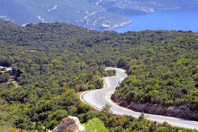 High angle view of road amidst trees and mountains