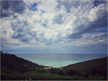 Scenic view of sea against cloudy sky