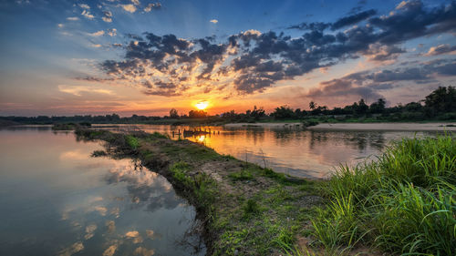 Scenic view of lake against sky during sunset