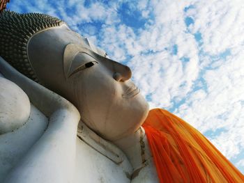 Low angle view of building against cloudy sky