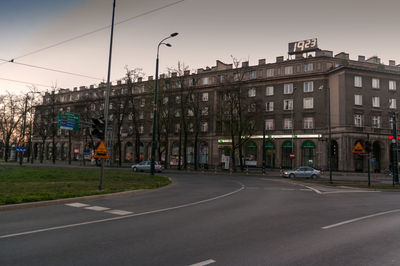 City street and buildings against sky
