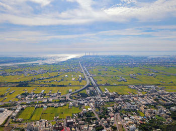 High angle view of city buildings against sky