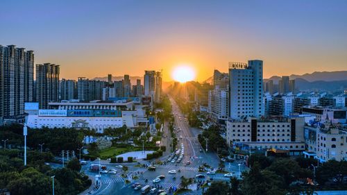 High angle view of buildings against sky during sunset