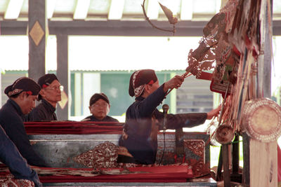 Traditional wayang kulit performances, a puppeter performs wayang kulit