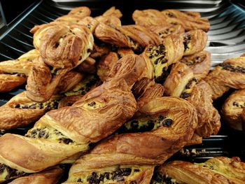 Close-up of baked pastry items for sale