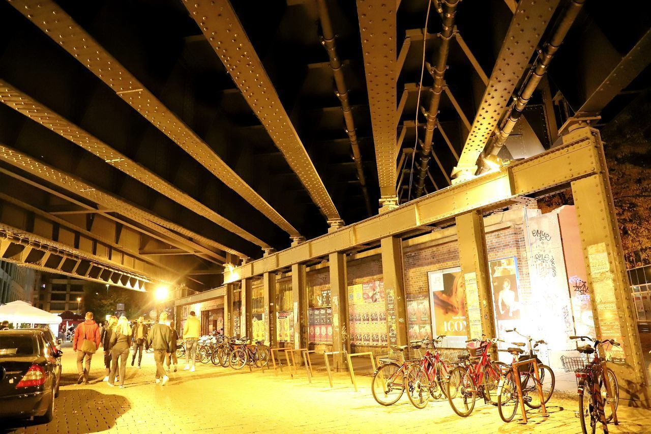 BICYCLES PARKED ON BRIDGE IN CITY