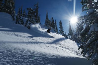 Scenic view of snowcapped mountain against sky during winter