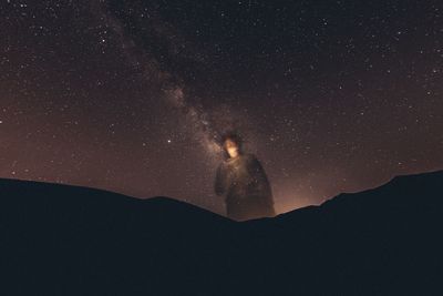 Scenic view of star field against sky at night