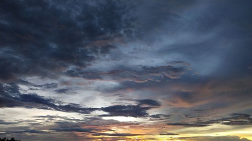 Low angle view of dramatic sky during sunset