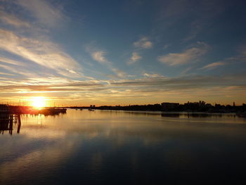 Scenic view of lake against sky during sunset