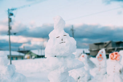 Close-up of anthropomorphic face on snow