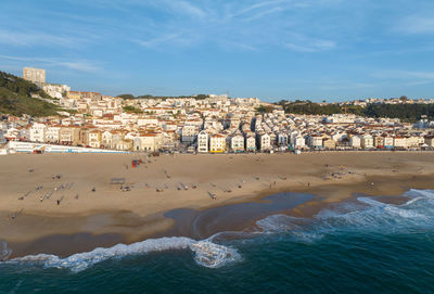 Nazare town in portugal. beach and cityscape. drone point of view.