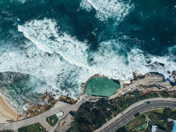 High angle view of swimming pool by sea