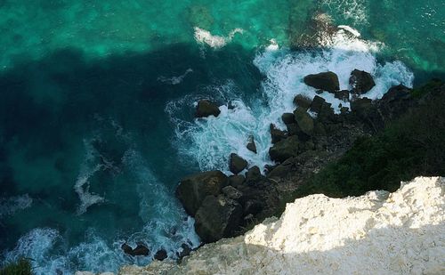 High angle view of rocks in sea