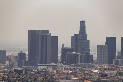 Modern buildings in city against sky
