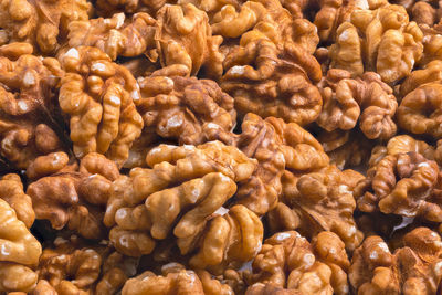 Full frame close-up background of walnuts pile without shells