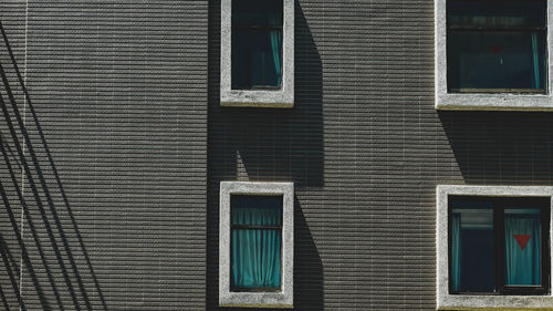 Low angle view of window on wall of building