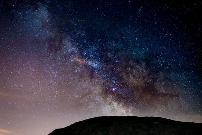 Low angle view of star field against sky at night