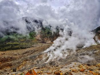 Smoke emitting from volcanic mountain