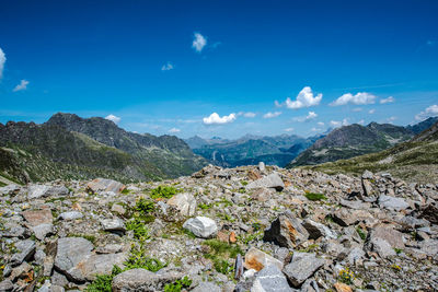 Scenic view of mountains against blue sky