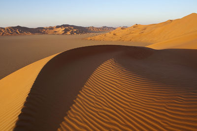 Scenic view of desert against clear sky