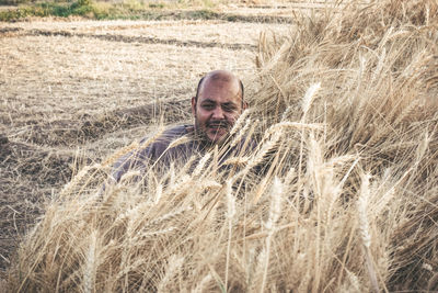 Portrait of young man in wheat field